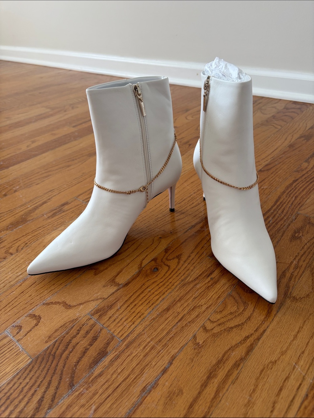 Schutz White Pointed-Toe Ankle Boots with Gold Chain Detail